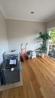 Enclosed living room prior to open-plan load-bearing wall removal.
