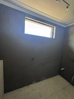 Internal rendering achieving plumb, true wall planes.
