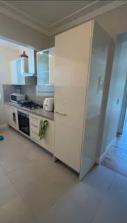 Dark, enclosed existing kitchen with minimal daylight.