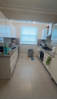 Compromised prep space and outdated cabinetry.