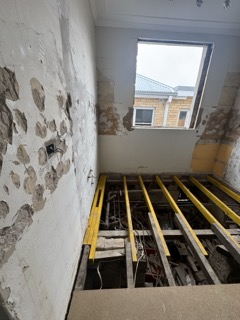 Structural timber subfloor remediation and framing reinforcement.
